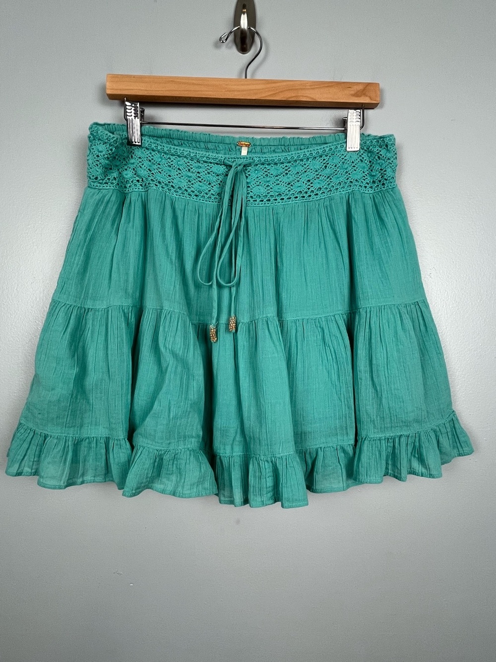 Free People green 100% cotton tiered crochet detail mini skirt, medium.